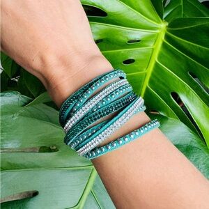 Vintage green leather punk rock style bracelet covered in rhinestones